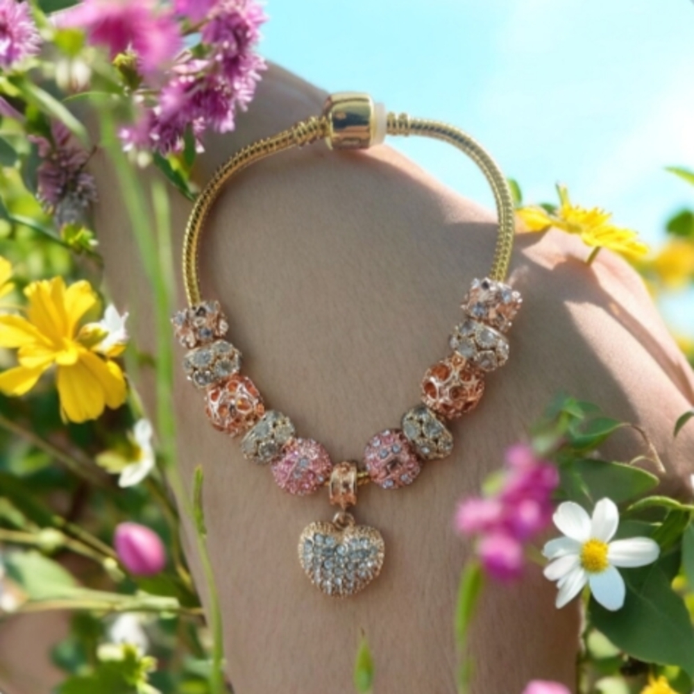 Elegant Gold and Pink Charm Bracelet